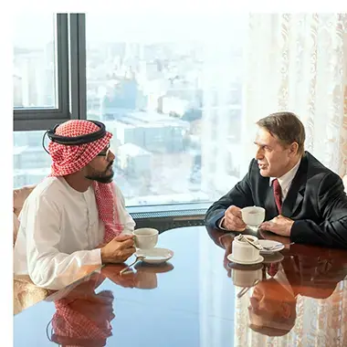 Saudi business professional and Western consultant in discussion over additive manufacturing strategy