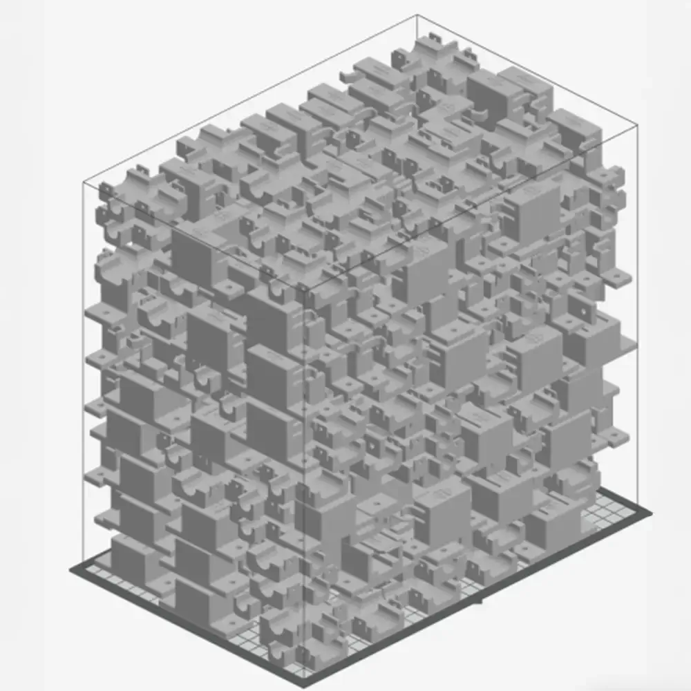 Dense build chamber showing SAF 3D-printed wire harness tooling packed for maximum throughput