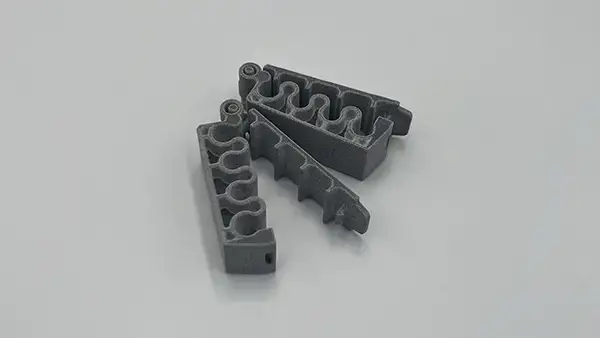 SAF 3D-printed cable clip fixture with integrated hinge design