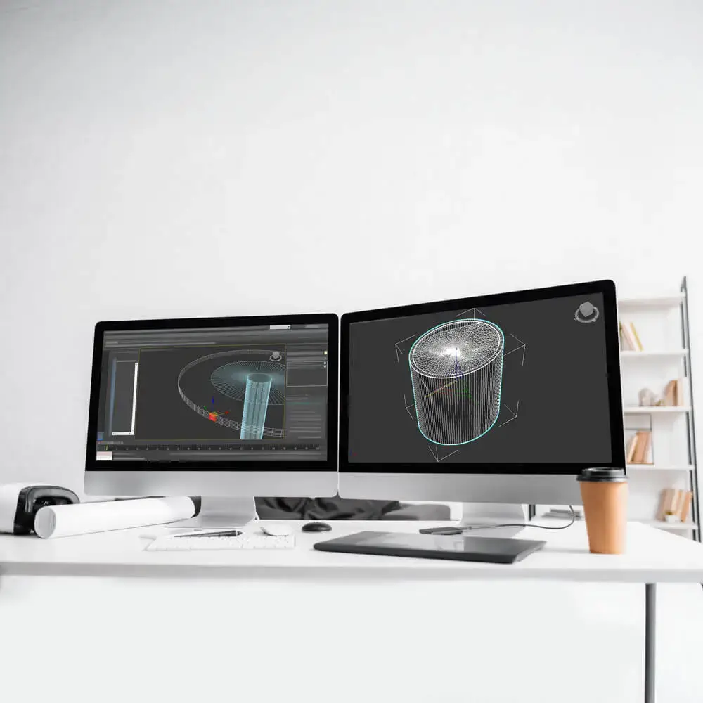Dual monitors showing 3D CAD design for additive manufacturing with DfAM focus on efficiency and profitability
