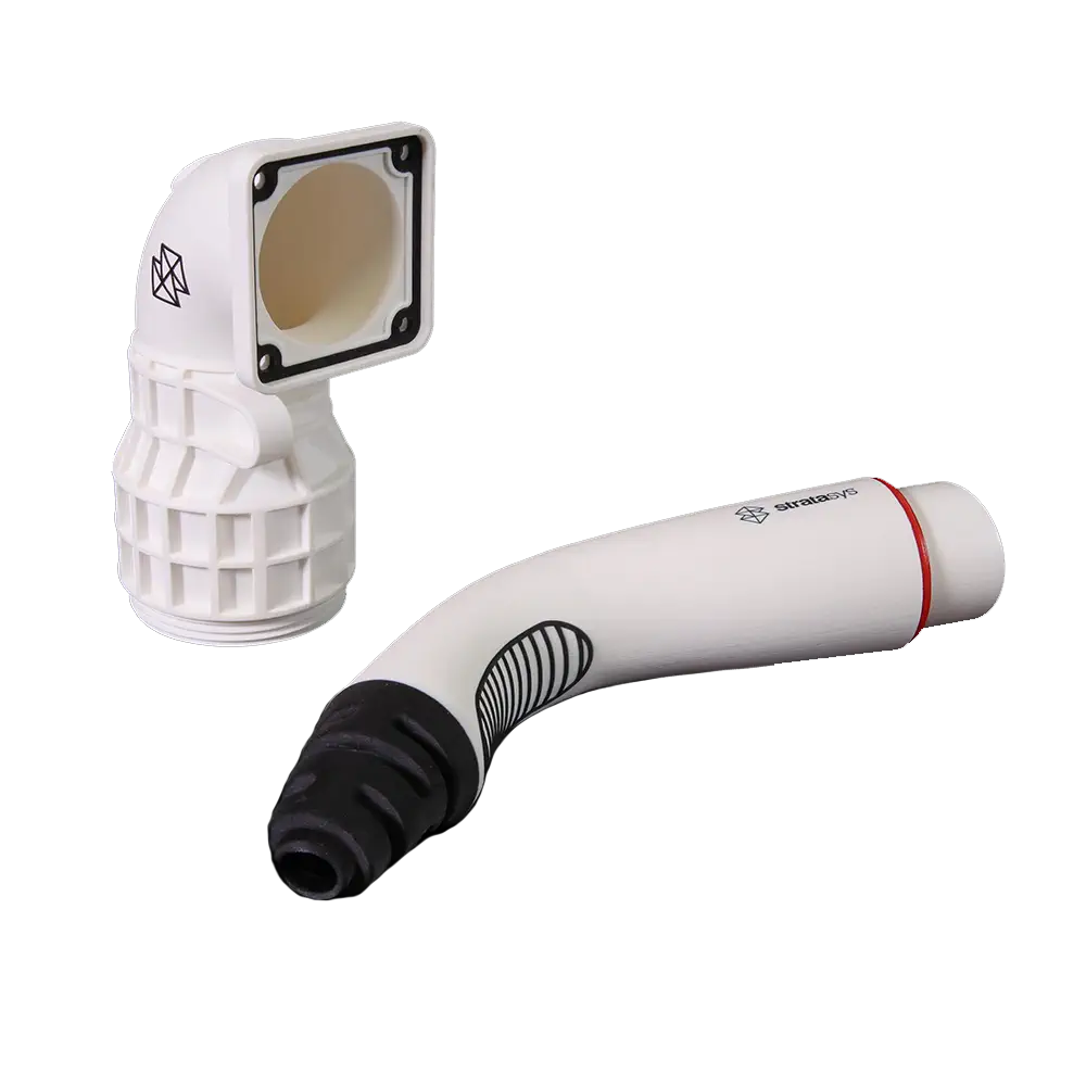 Functional prototypes 3D printed in white ToughONE PolyJet material, showing a complex duct and a multi-material handle.